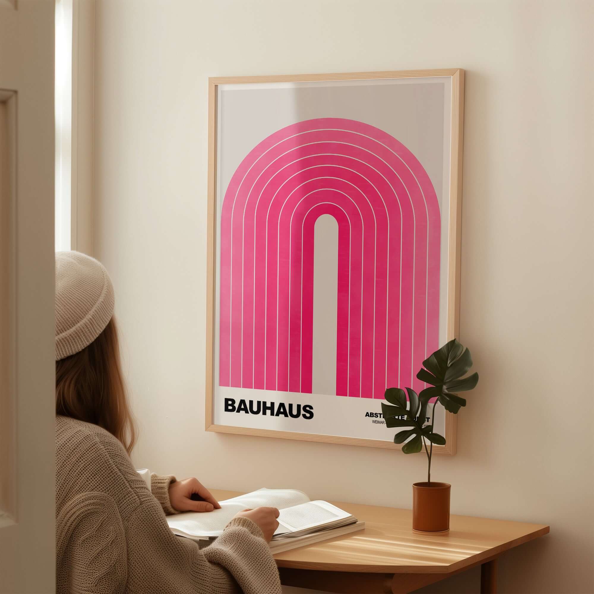 Bauhaus Exhibition Prints - Concentric Pink Arch Poster Minimalist Geometric Art displayed in a cozy room setting.