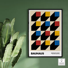 Bauhaus Exhibition Prints - Isometric Cubes Art Print Red Yellow Blue Design displayed on a wall with greenery in the background.