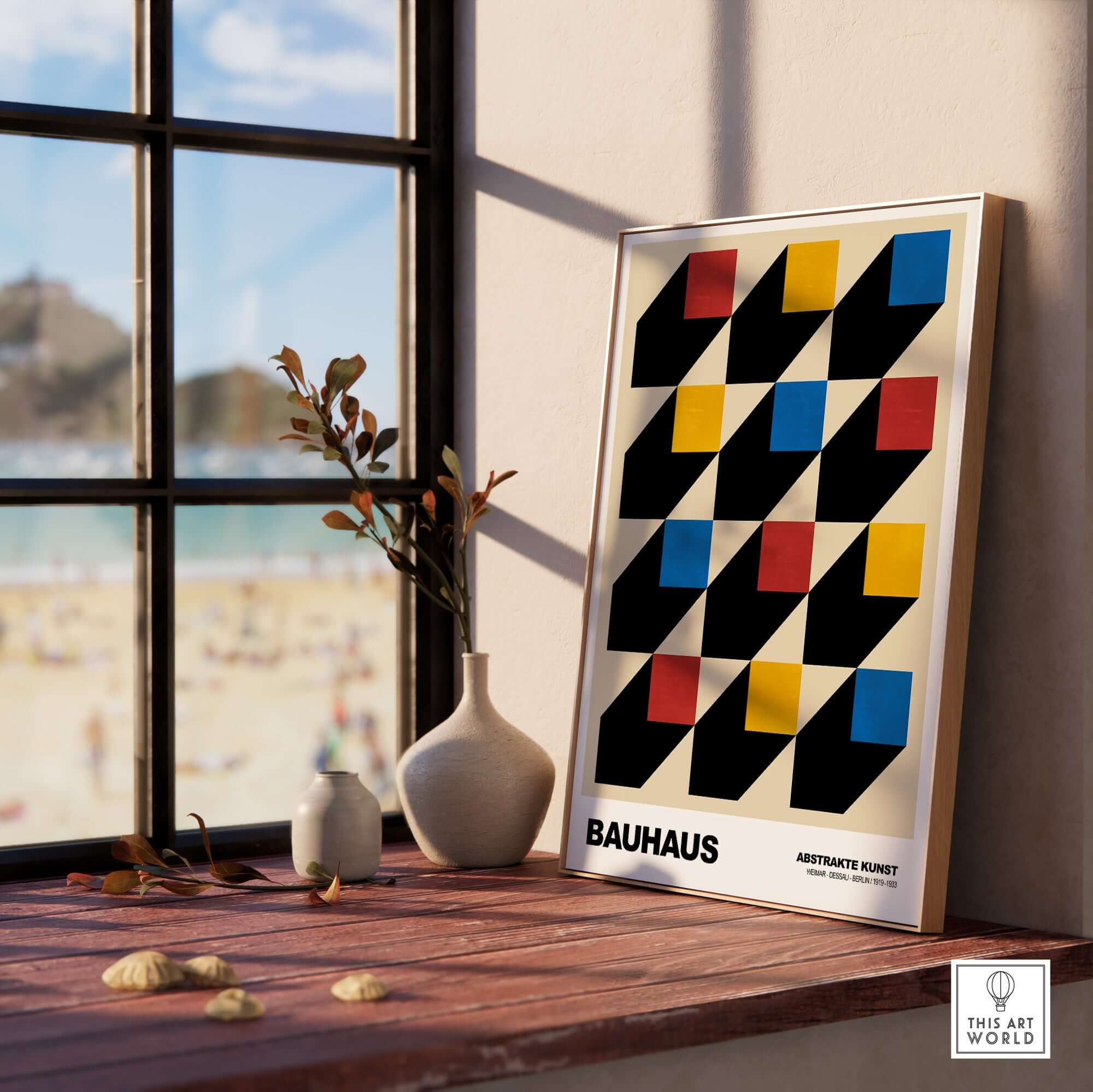 Bauhaus Exhibition Prints - Isometric Cubes Art Print Red Yellow Blue Design displayed on a windowsill with beach view.