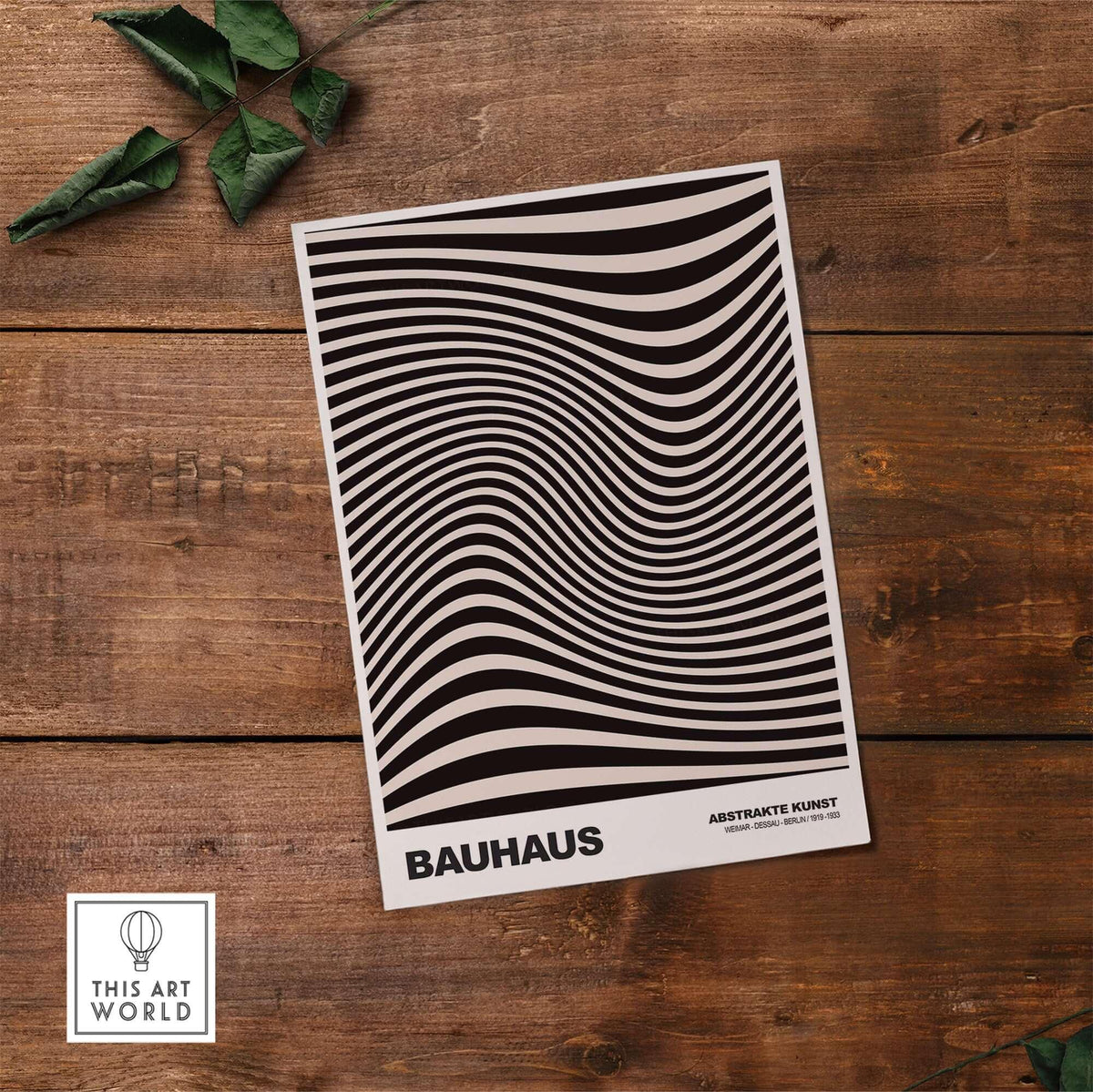 Bauhaus Exhibition Prints -  Optical Wave Lines Art Print Black Cream Abstract on a wooden table with greenery.