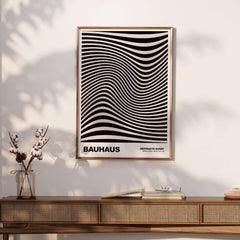 Bauhaus Exhibition Prints -  Optical Wave Lines Art Print Black Cream Abstract displayed on a wall over a wooden console.