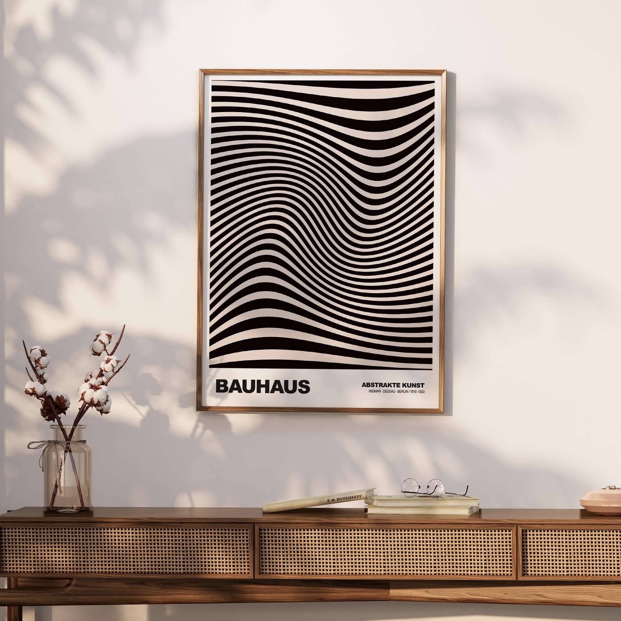 Bauhaus Exhibition Prints -  Optical Wave Lines Art Print Black Cream Abstract displayed on a wall over a wooden console.
