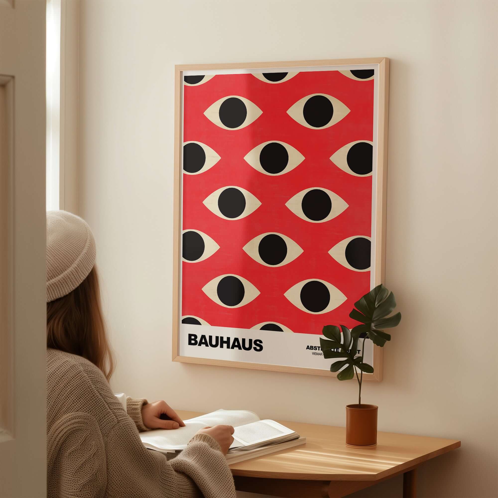 Bauhaus Exhibition Prints - Repeating Eyes Pattern Poster Red Black Cream Art displayed on a wall in a stylish interior.