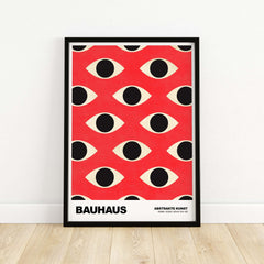 Bauhaus Exhibition Prints - Repeating Eyes Pattern Poster Red Black Cream Art featuring abstract eye patterns on vibrant red background.
