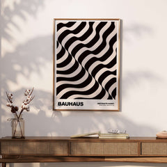 Bauhaus Exhibition Prints - Thick Undulating Waves Poster Black Cream Abstract Art framed on a wall with stylish decor.