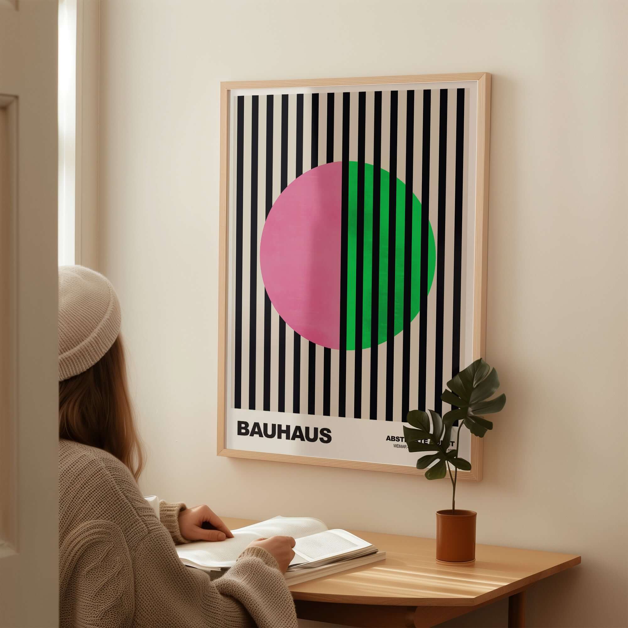Bauhaus Exhibition Prints - Split Circle Abstract Art Print Pink Green Stripes displayed in a cozy room setting.