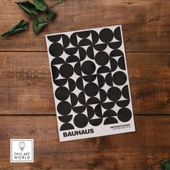 Bauhaus Exhibition Prints - Geometric Circle Shapes Art Print Black White Pattern on wooden background.