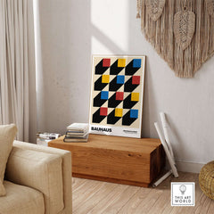 Bauhaus Exhibition Prints - Isometric Cubes Art Print Red Yellow Blue Design displayed in a stylish living room setting.