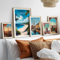 Bermuda Wall Art collection featuring colorful travel posters in stylish frames on a modern couch.
