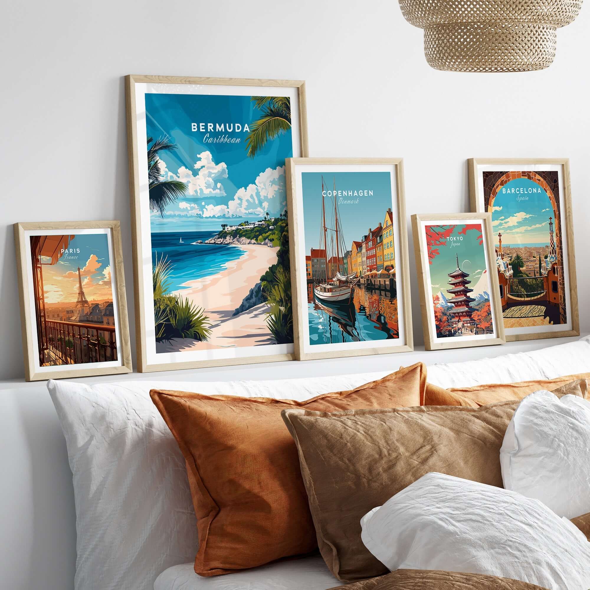 Bermuda Wall Art collection featuring colorful travel posters in stylish frames on a modern couch.