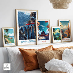 Bernina Express Poster | Snowy Mountain Train Poster displayed among other travel art prints on a stylish shelf.