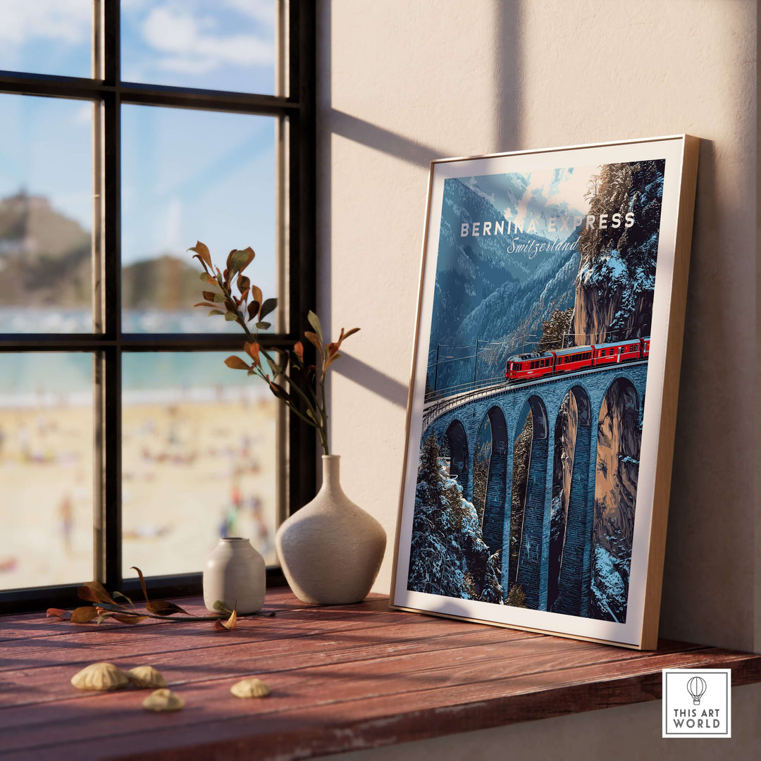 Bernina Express Swiss Alps UNESCO Winter Print | Scenic Rail Wall Decor framed on a wooden table with a view of a beach.