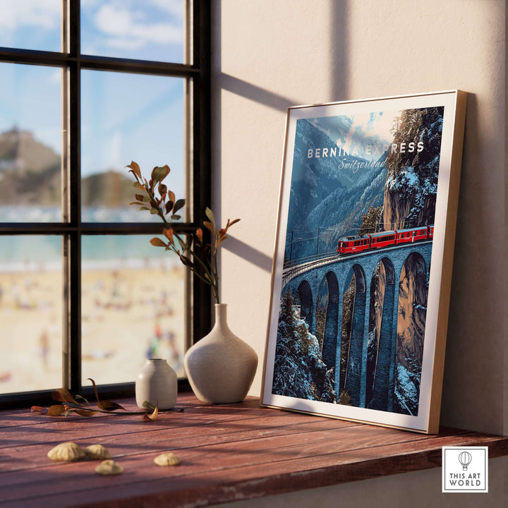 Bernina Express Swiss Alps UNESCO Winter Print | Scenic Rail Wall Decor framed on a wooden table with a view of a beach.