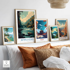 Betws-y-Coed Poster Wales Art Print displayed among other travel art prints on a stylish wall.
