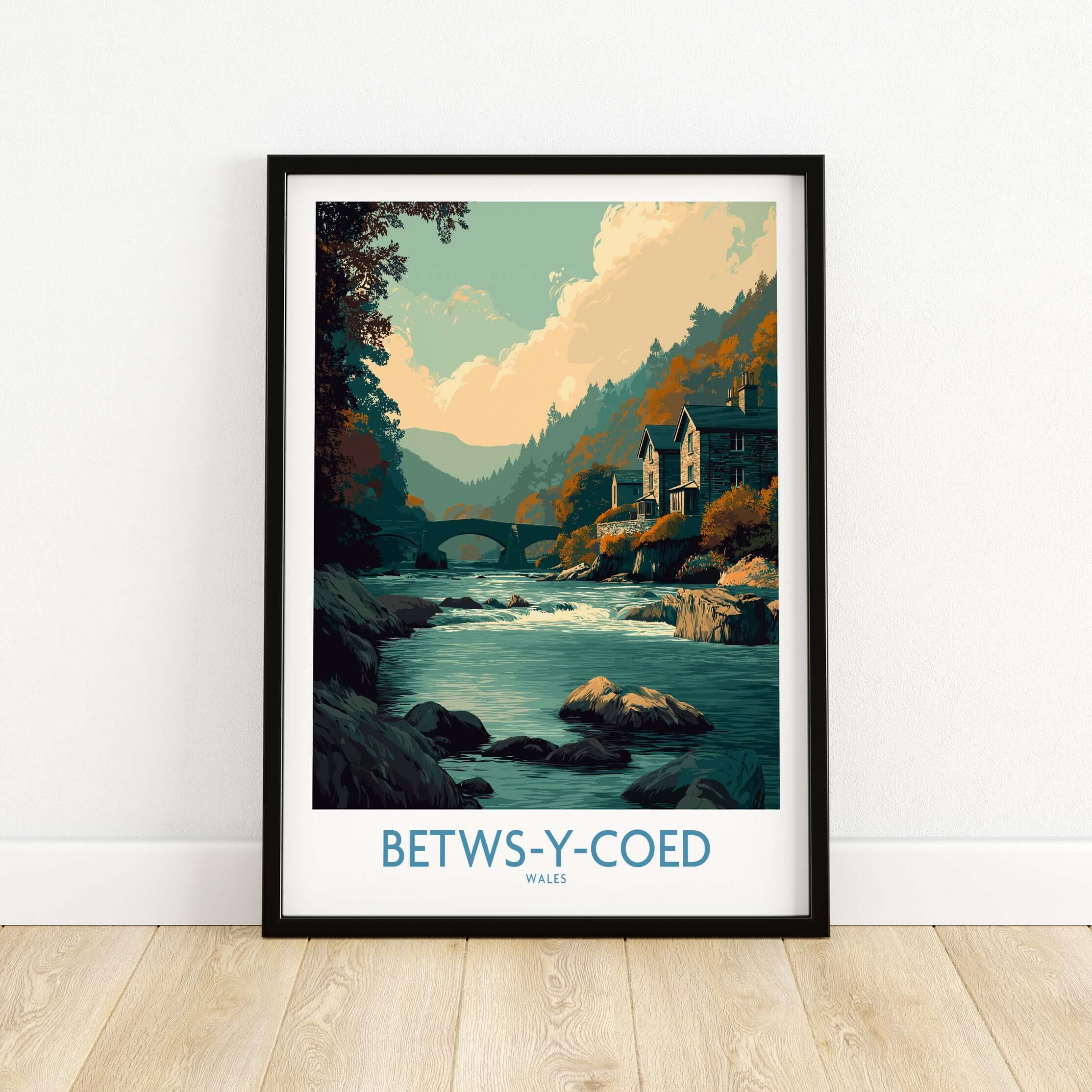 Betws-y-Coed Poster Wales Art Print featuring a serene river landscape with charming buildings and mountains.