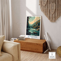 Betws-y-Coed Poster Wales Art Print displayed in a cozy living room, showcasing natural beauty and rustic elegance.