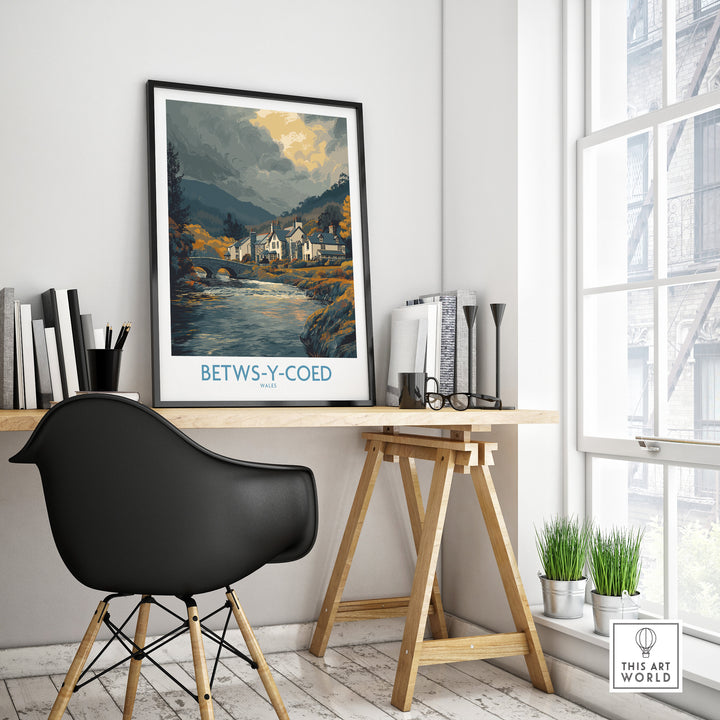 Betws-y-Coed poster displayed in a modern home office, showcasing the Welsh countryside landscape.