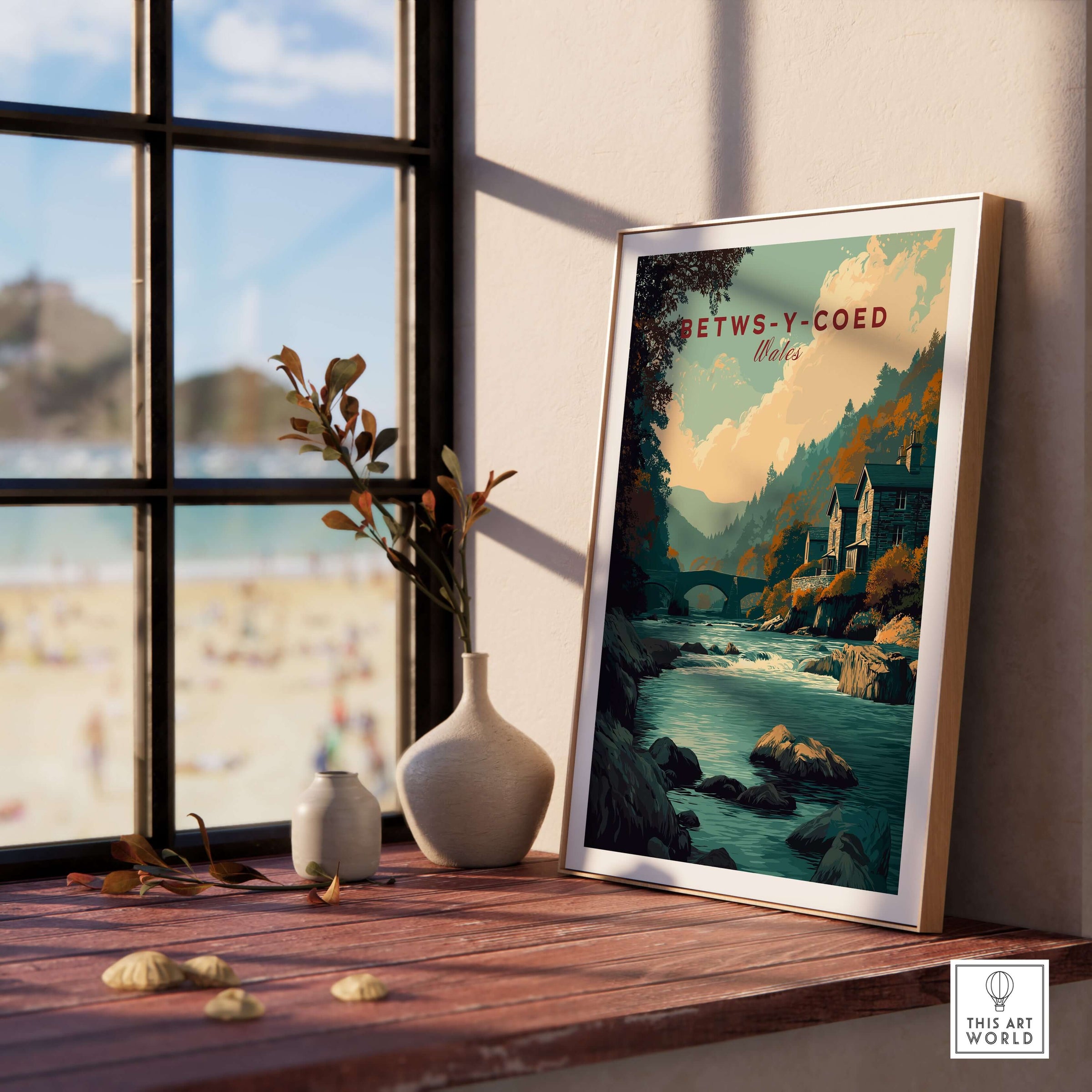 Betws-y-Coed Travel Print Wales displayed in a cozy interior with natural light and decorative elements.