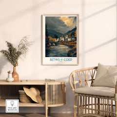 Betws-y-Coed Poster Wales Countryside Landscape Print showcasing serene village and river scene in a cozy interior.