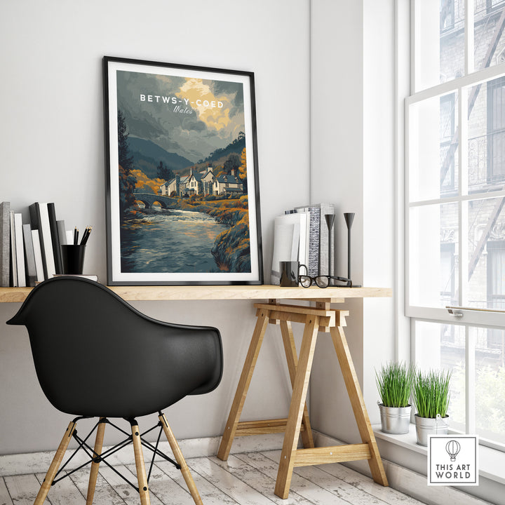 Betws-y-Coed Wales travel poster displayed in a modern workspace, showcasing scenic natural beauty.
