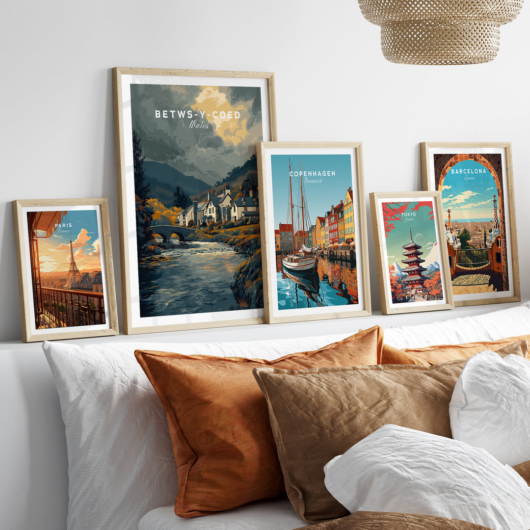 Framed travel posters including Betws-y-Coed, showcasing scenic landscapes and cultural highlights.