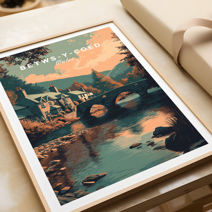 Betws-y-Coed Wales village art print featuring a scenic view of a bridge and charming houses.