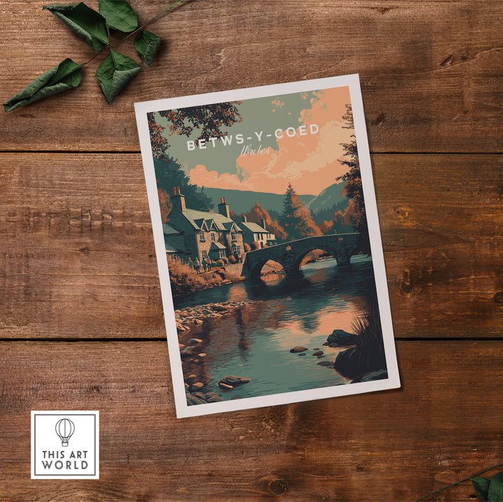 Betws-y-Coed Wales village art print featuring scenic landscapes and charming architecture on a wooden background.