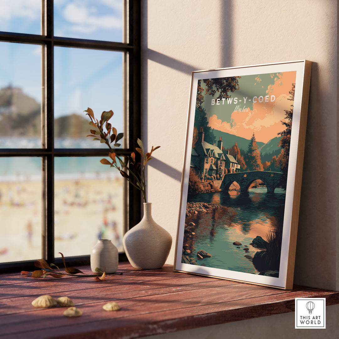 Betws-y-Coed Wales village art print displayed by a window, showcasing scenic landscapes and charming architecture.