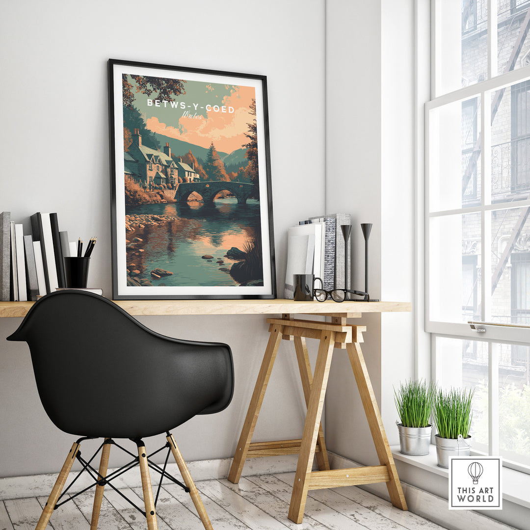 Betws-y-Coed scenic art print displayed in modern workspace, capturing Welsh village charm.