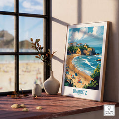 Biarritz Travel Poster displayed on a windowsill, showcasing a colorful beach scene of Biarritz, France.