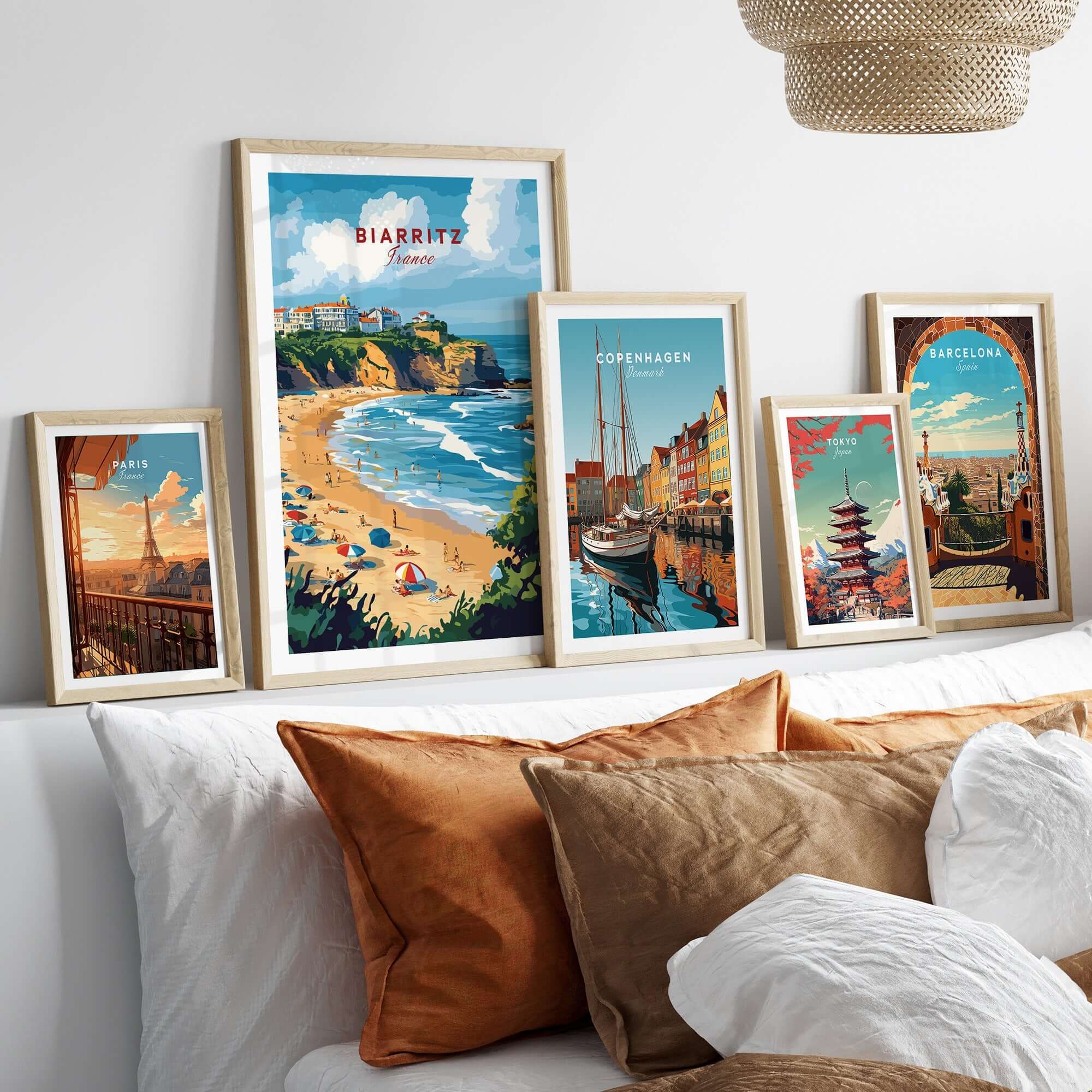 Biarritz Travel Print displayed on a wall with other travel prints featuring beautiful scenes from different cities.