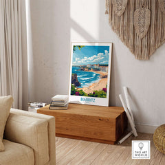 Biarritz Wall Art Print displayed in a stylish living room, showcasing vibrant coastal scenery and enhancing home decor.