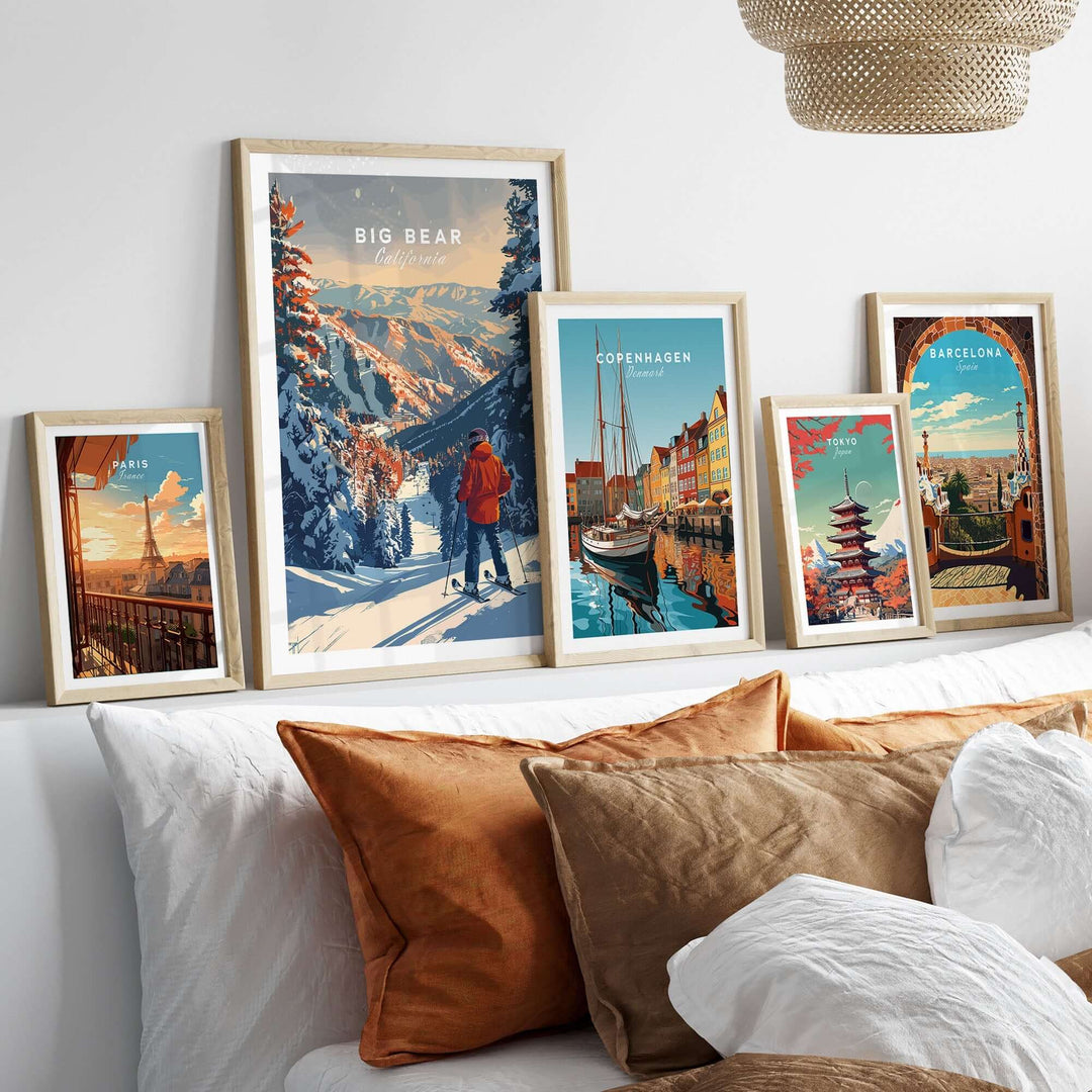 Big Bear travel poster displayed among other vibrant city posters on a stylish shelf above a cozy bed.