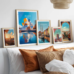 Vibrant framed Bilbao Print Spain among other city prints in a stylish living room setting.