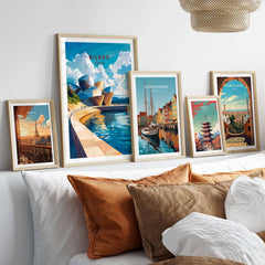 Bilbao Wall Art displayed in stylish frames above a bed, featuring colorful cityscapes and iconic architecture.