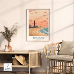 Blackpool Sunset Tower Beach Art Print | Pink Sky UK Coastal Poster displayed in a stylish living room setting.