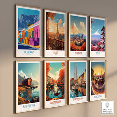 Colorful art prints of global landmarks including Bo-Kaap, Paris, Florence, and Tokyo displayed on a gallery wall.