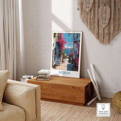 Bodrum Turkey Print - Coastal Village Wall Decor featuring a vibrant street scene with pink flowers and blue waters.