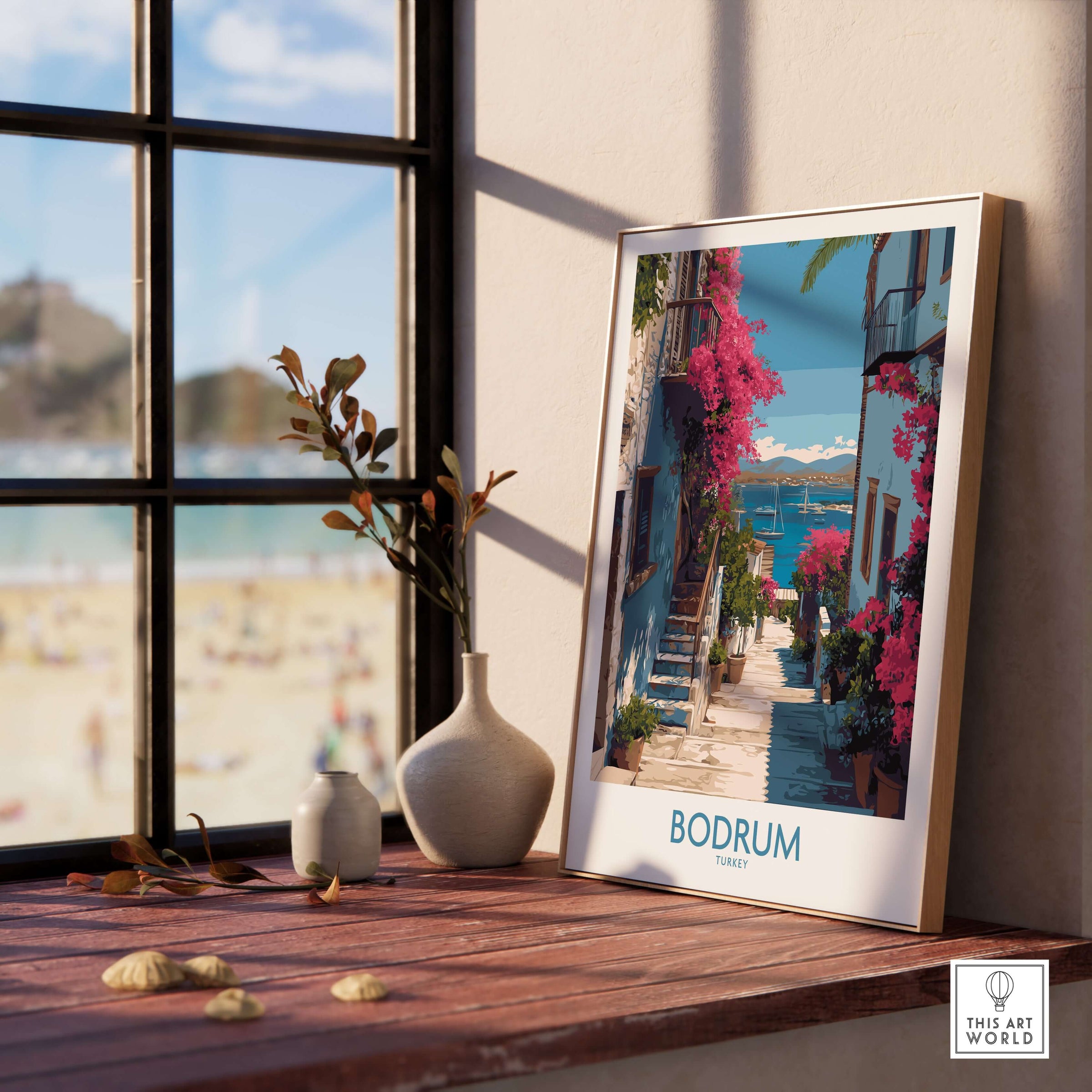Bodrum Turkey Print - Coastal Village Wall Decor displayed in a sunlit room with flowers and beach view.