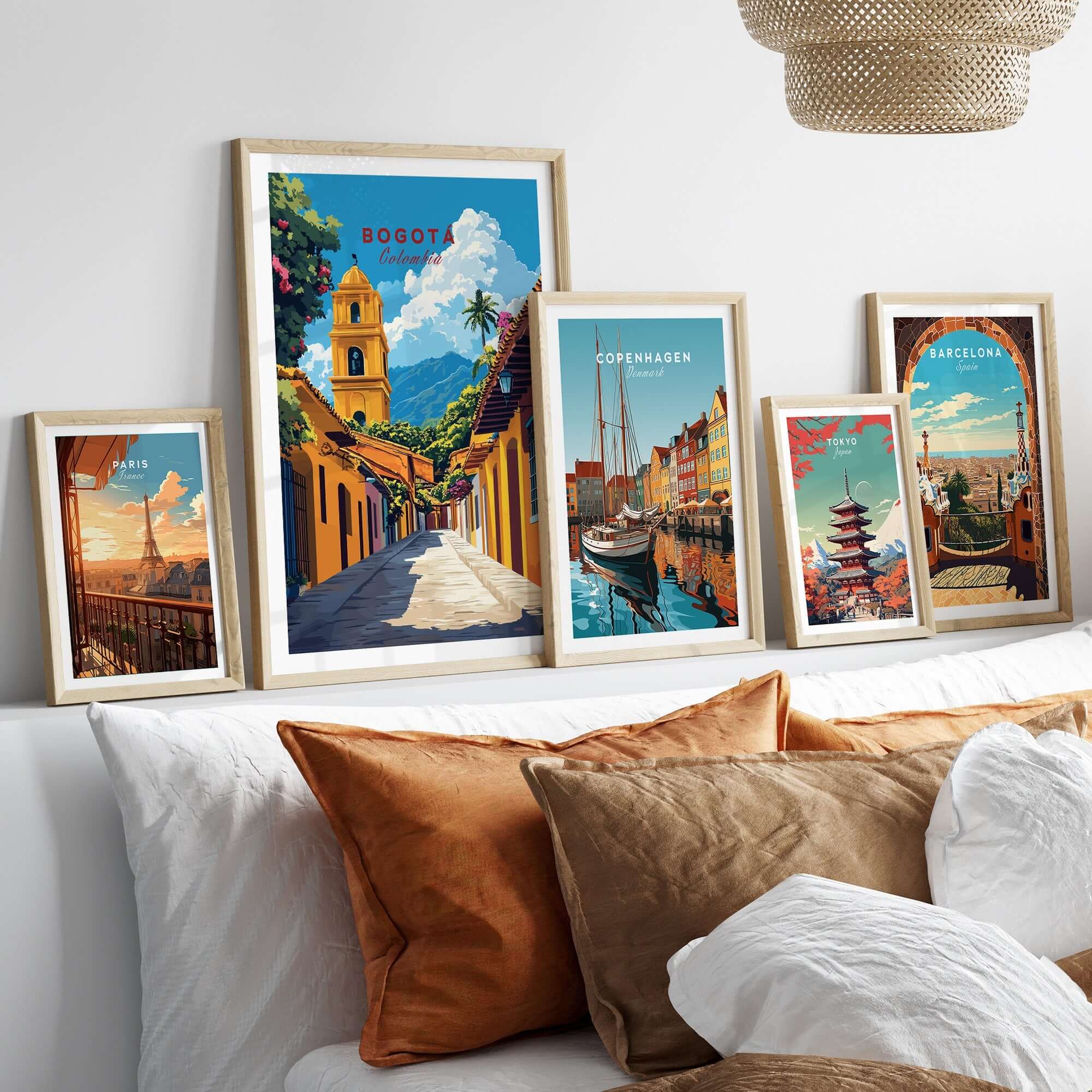 Bogota Print Colombia showcased on a stylish wall above a cozy bed with other travel-themed prints.