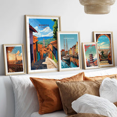 Bogota Travel Print displayed among framed travel posters on a stylish sofa with decorative pillows.