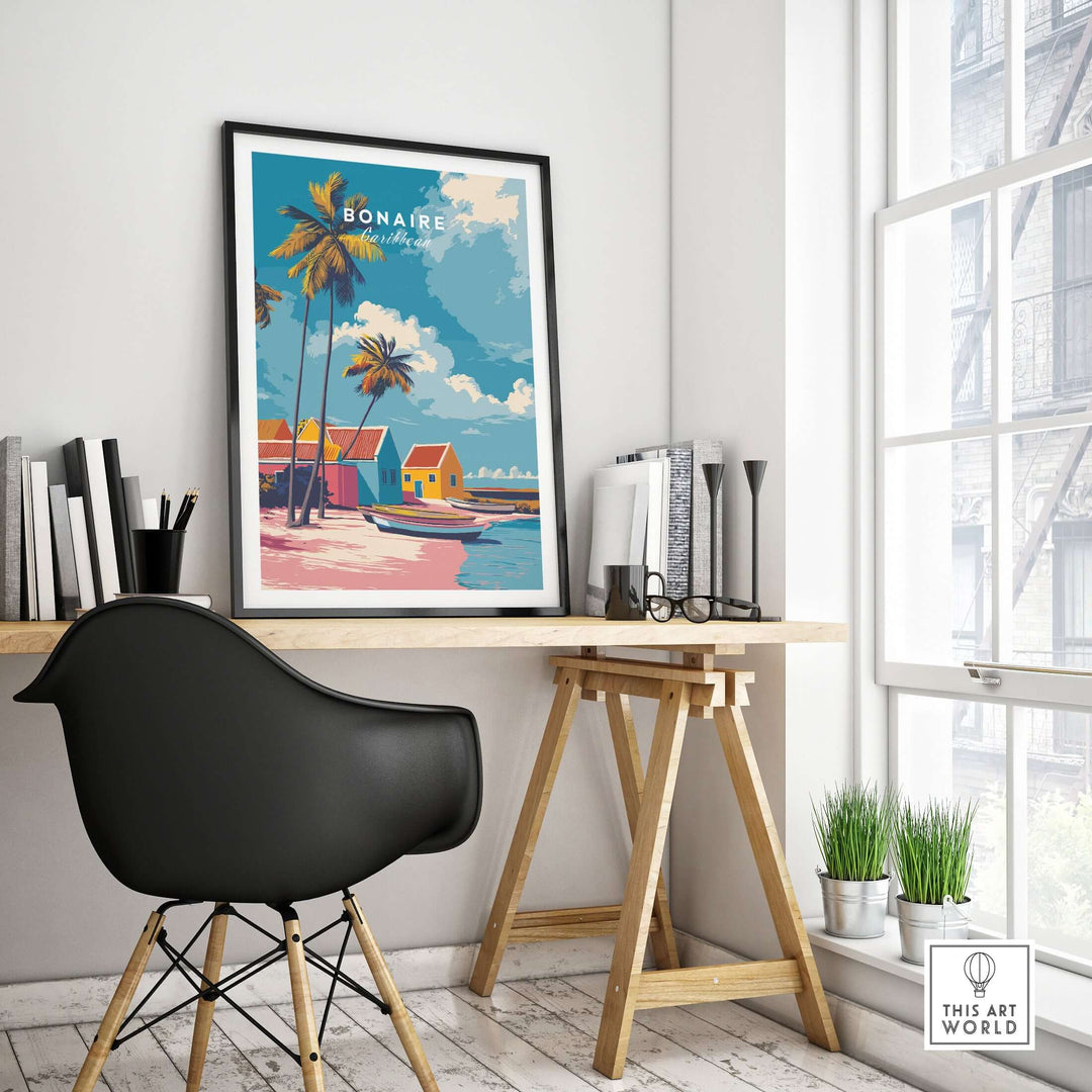 Bonaire Caribbean colorful houses art print framed on a modern desk with plants, evoking tropical beach vibes.