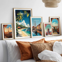 Boracay Philippines Travel Print and other travel art prints displayed in stylish frames on a cozy couch.