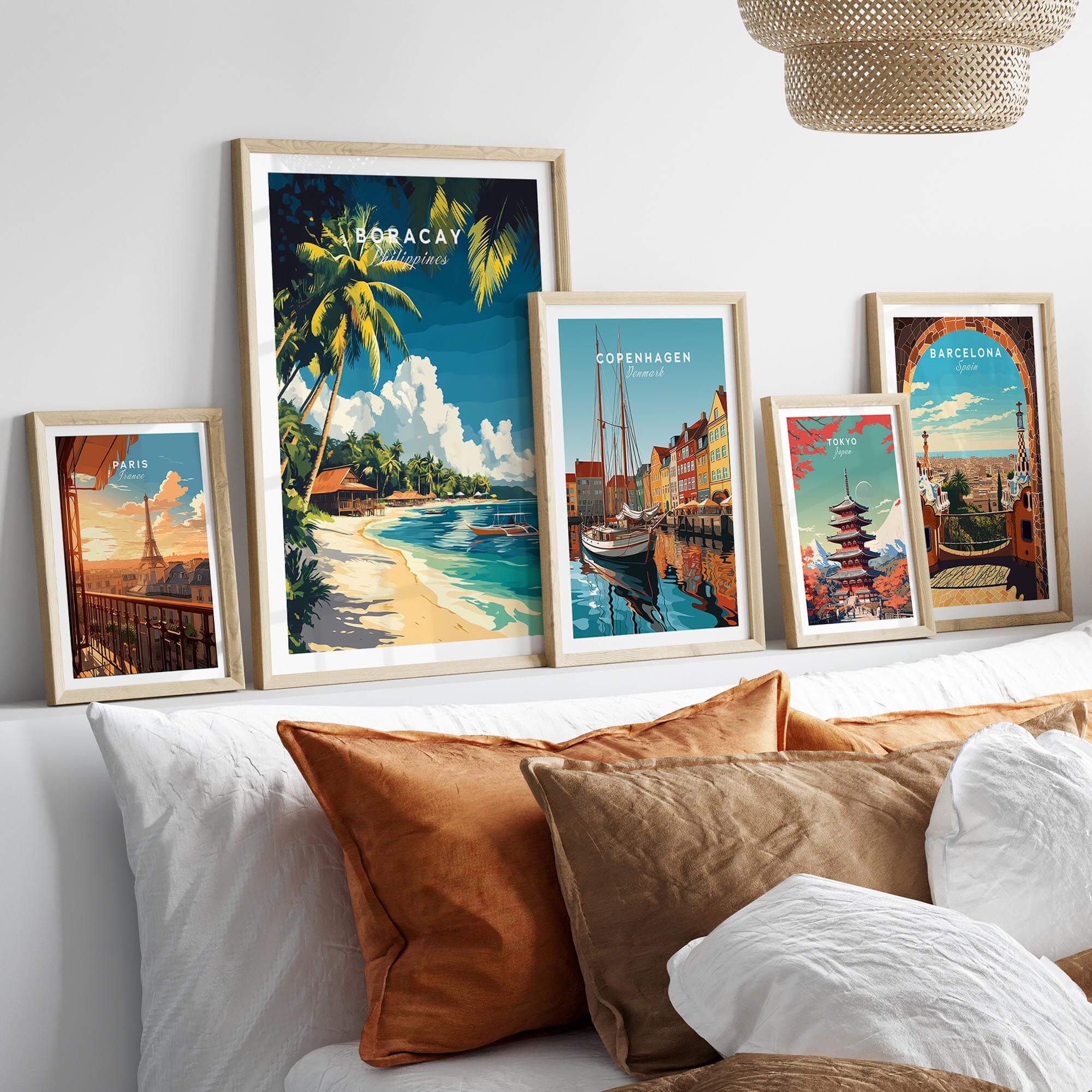 Boracay Philippines Travel Print and other travel art prints displayed in stylish frames on a cozy couch.