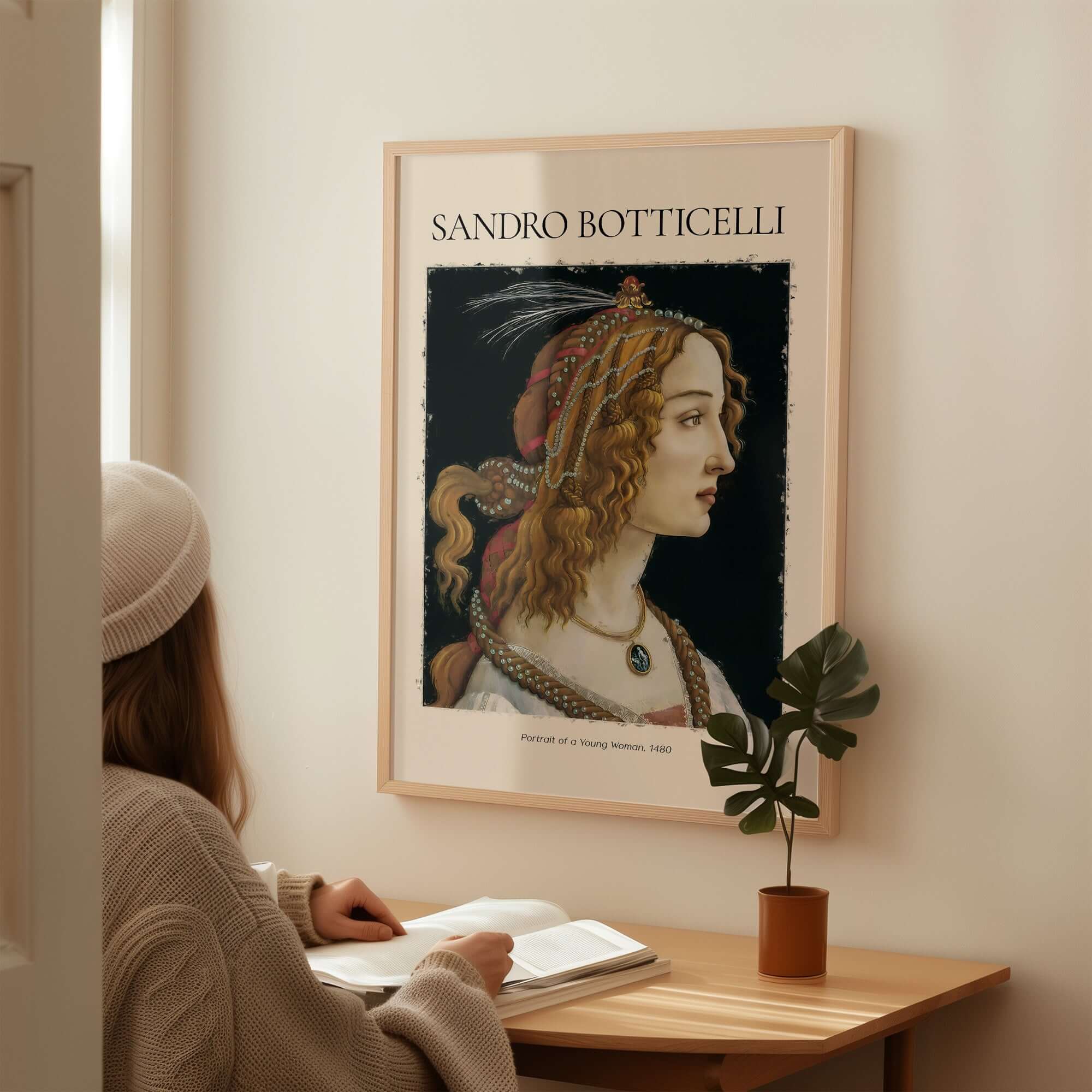 Botticelli Portrait of a Young Woman Simonetta Vespucci Art Print Renaissance Poster displayed on wall in cozy room.