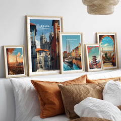 Braga Historic Centre Print | Portuguese Urban Wall Art displayed among other travel prints on a cozy bed with decorative pillows.