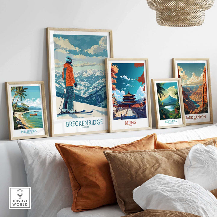 Collection of travel prints including Breckenridge, Beijing, Costa Rica, and the Grand Canyon displayed in a cozy living room setting.