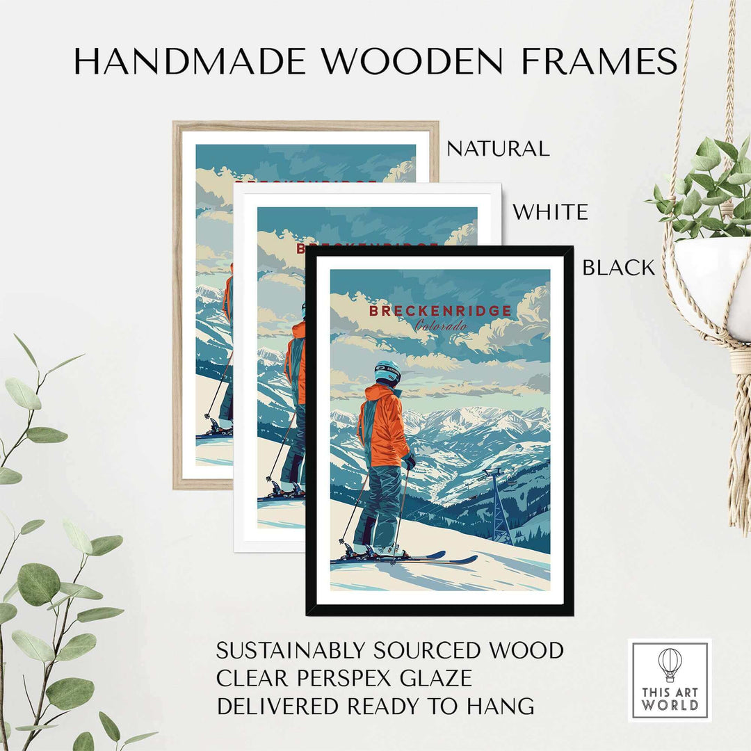 Three handmade wooden frames in natural, white, and black showcasing a Breckenridge travel poster against a plant backdrop.