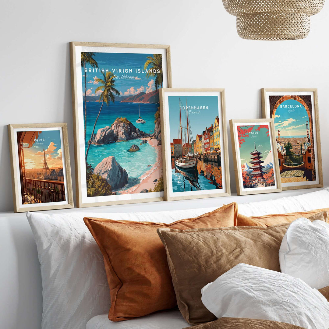 Gallery of travel posters including British Virgin Islands, Copenhagen, and Barcelona on a stylish sofa.