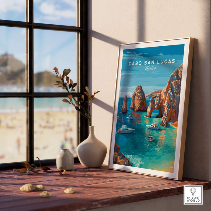 Cabo San Lucas travel poster featuring El Arco, turquoise waters, and boats in a stylish indoor setting.